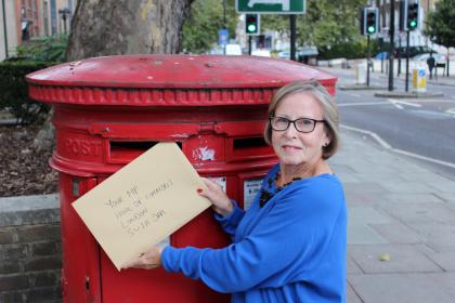 A Target Ovarian Cancer campaigner posting a letter to their local representative