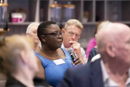 A woman asking a question at a Target Ovarian Cancer Ask the Experts event