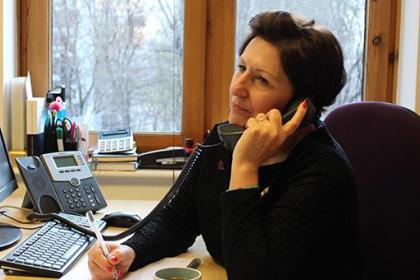 Target Ovarian Cancer Nurse Adviser, Val Lang, on the phone listening and taking notes