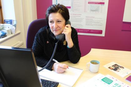 Target Ovarian Cancer Nurse Adviser, Val Lang, taking a call on our support line