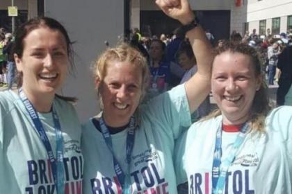 Jo Edwards and two other runners with their medals after finishing the Bristol 10K