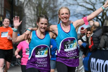Two Target Ovarian Cancer fundraisers running and waving