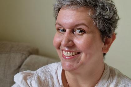 Megan after treatment taking a selfie, smiling 