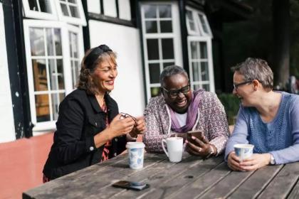 campaigners talking over tea 