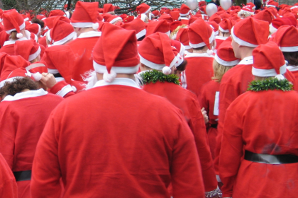 A photo of a large crowd with everyone dressed as Santa