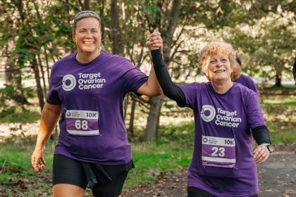 Two female supporters smiling at the Target Ovarian Cancer London Walk|Run 2023