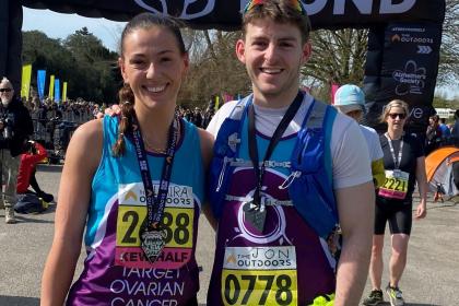 Two supporters smiling at the Run Kew finish line, 2022