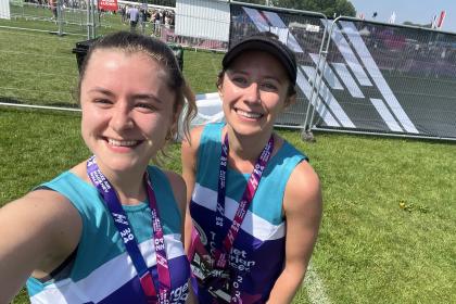 Two female supports smiling at the Hackney Half Marathon 2024