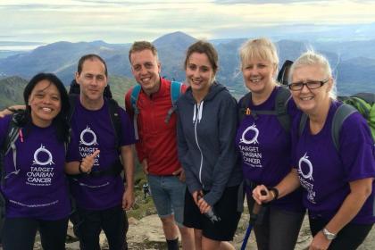 A group of supporters climbing mount Snowdon.