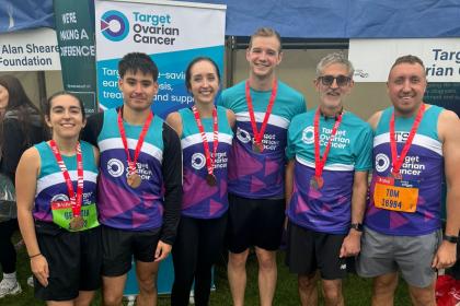  Group of supporters smiling at the Great North Run charity village 2024