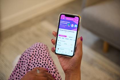 Image of a phone showing the Ovarian Cancer Community