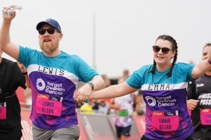 Female and Male supporter running at the Great North Run 2025