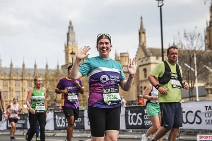 A female supporter running and smiling, 2025
