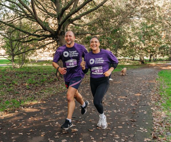 Man and Woman running at the Target Ovarian Cancer London Walk|Run event 2023