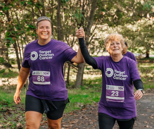Two female supporters smiling at the Target Ovarian Cancer London Walk|Run 2023