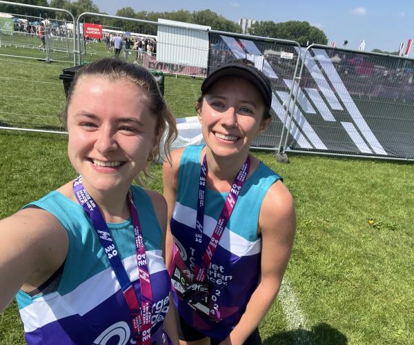 Two female supports smiling at the Hackney Half Marathon 2024