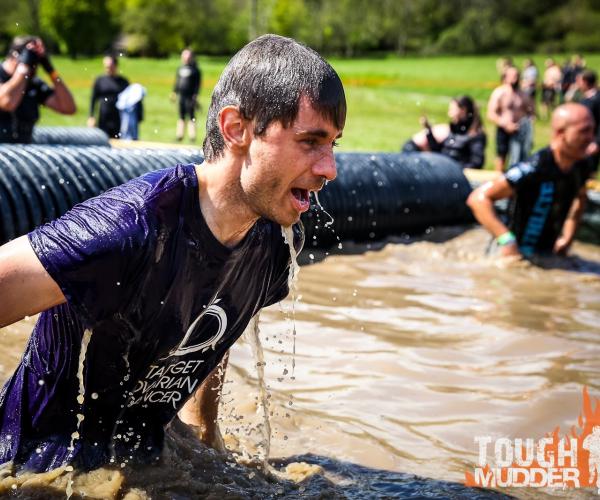 A male supporter at a Tough Mudder event