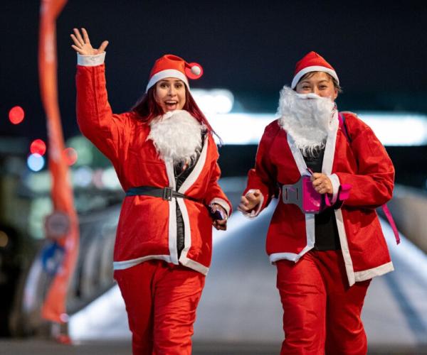 2 runners in Santa costumes at Santa in the City, London. Photo from #sanatinthecity