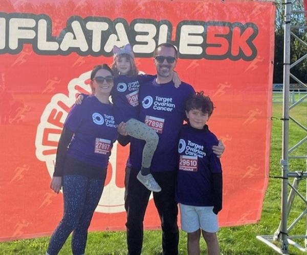 Family of supporters smiling at the Inflatable 5k 2024