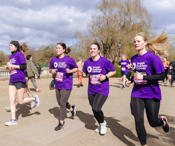 Four female supporters running at Run 11, 2024