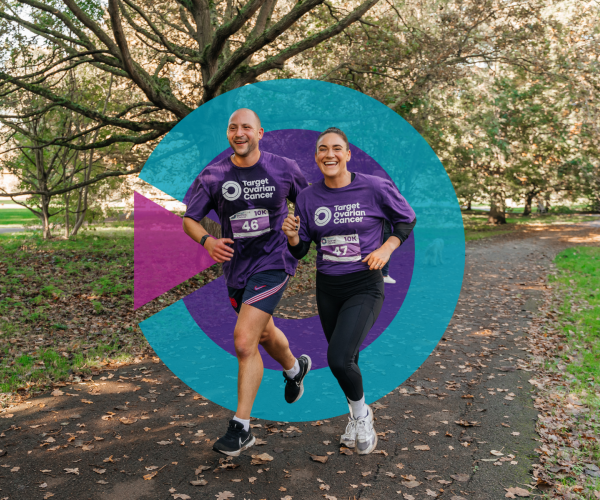 Two people running through a park with the Target Ovarian Cancer logo behind them