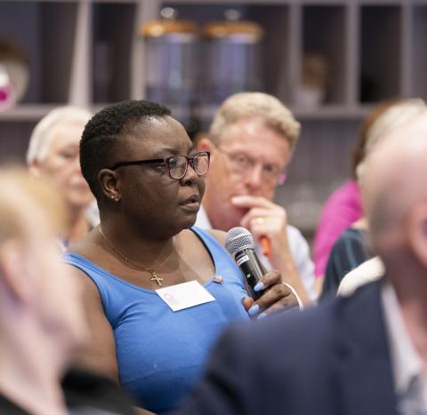 A woman asking a question at a Target Ovarian Cancer Ask the Experts event