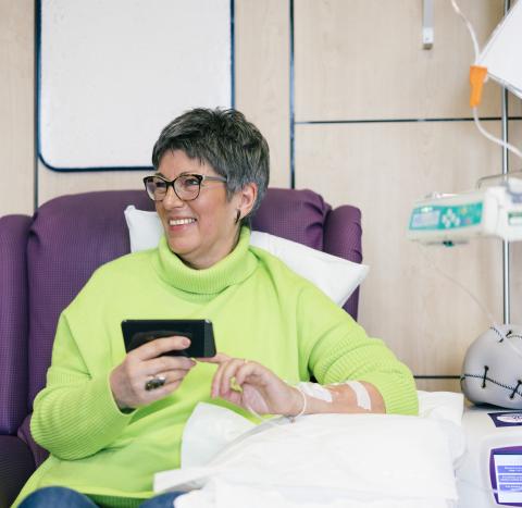 woman on phone having chemo
