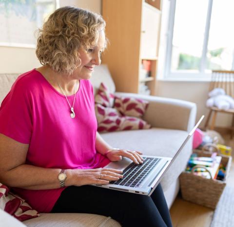 Woman with ovarian cancer using a laptop