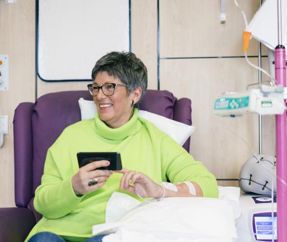woman on phone having chemo