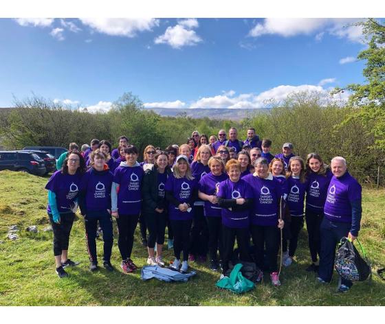 A group of  Target Ovarian Cancer fundraisers smiling together on a sponsored walk