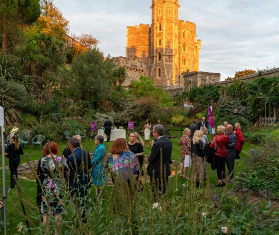 Guests enjoying an evening event in the grounds of Windsor castle
