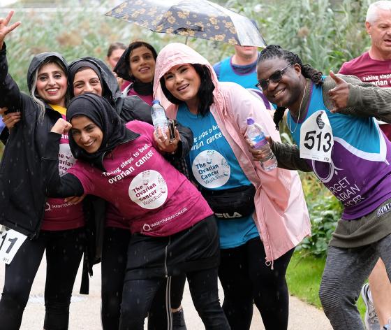 A group of fundraisers taking part in the Ovarian Cancer Walk|Run, smiling and laughing at the camera.jpg