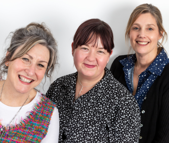 A photo of Target Ovarian Cancer's specialist support line nurses, Val, Rachel and Luisa