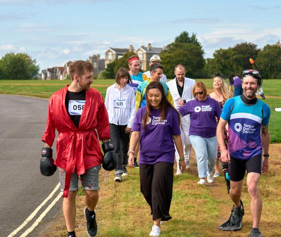 Several people walking, some of them in Target Ovarian Cancer t-shirts and some in fancy dress costumes