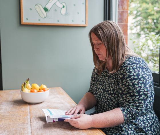 Woman reading an information guide