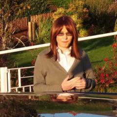 A photo of Amanda in October 2016 a month before her diagnosis sat outside in the garden