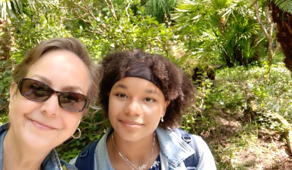 Sarah outside wearing sunglasses with her daughter