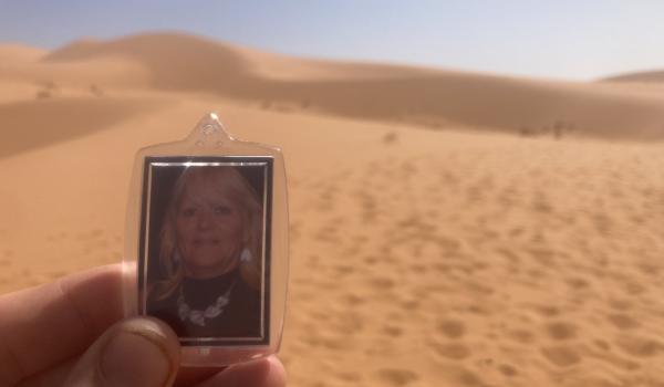 A keyring with Adam's mum Jackie's photo that he is holding up in the dessert whilst doing the Marathon Des Sables