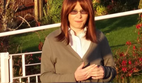 A photo of Amanda in October 2016 a month before her diagnosis sat outside in the garden