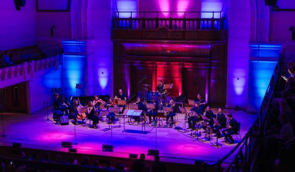 A photo of musicians on stage at Playing Our Part