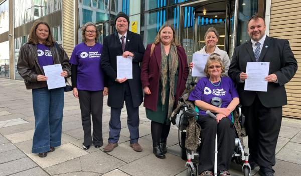 A group of Target Ovarian Cancer Campaigners, MPs and Policy team outside the Department of Health handing in a letter to the Minister.