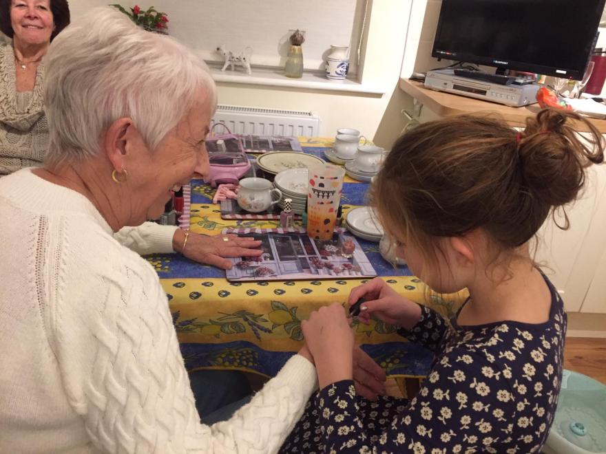 A girl paints her grandma's nails to raise money for Target Ovarian Cancer