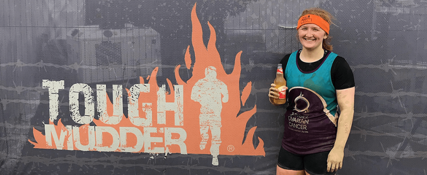 Georgia Gilson holding a drink after completing a Tough Mudder challenge for Target Ovarian Cancer