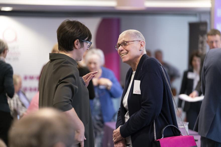 Women talking and mingling at a Target Ovarian Cancer Ask the Experts event