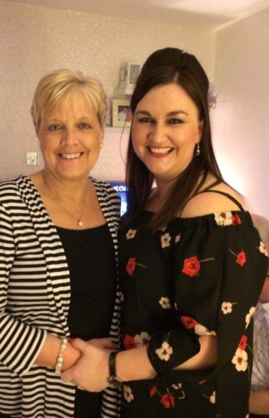 A photo of Mary and her daughter with their arms around each other
