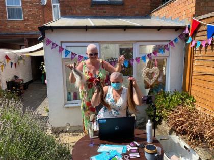 Two Target Ovarian Cancer fundraisers completing a headshave for Target Ovarian Cancer
