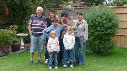 Chris and her wider family pose for a photo in the garden
