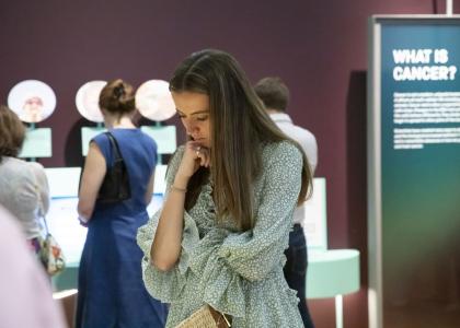 People browsing the Cancer Revolution: Science, Innovation and Hope exhibition.