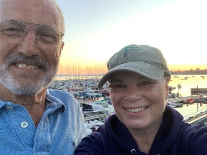 Tracy and her husband by the coast