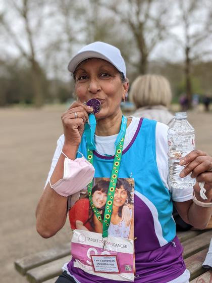 Anita after completing Run for Mum kissing her medal